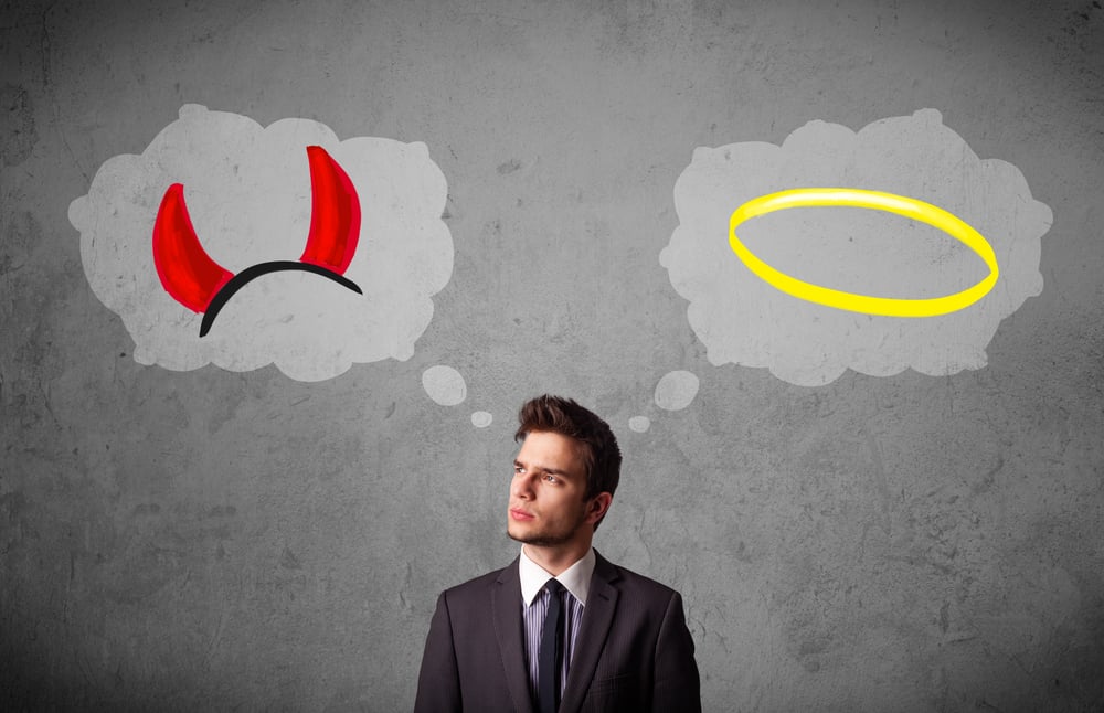 Young businessman choosing beetween the good and the bad